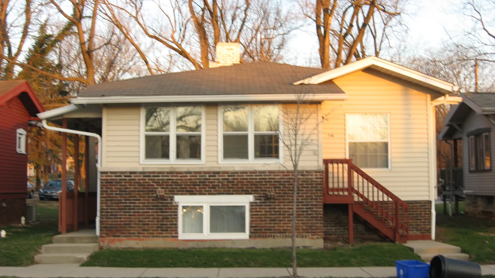Modest single-family home on a tree-lined residential street